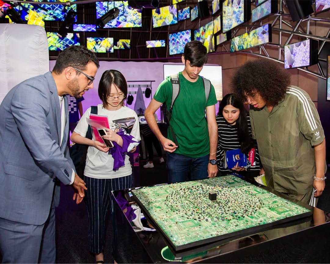 Visitor interacting with a touch-driven exhibit