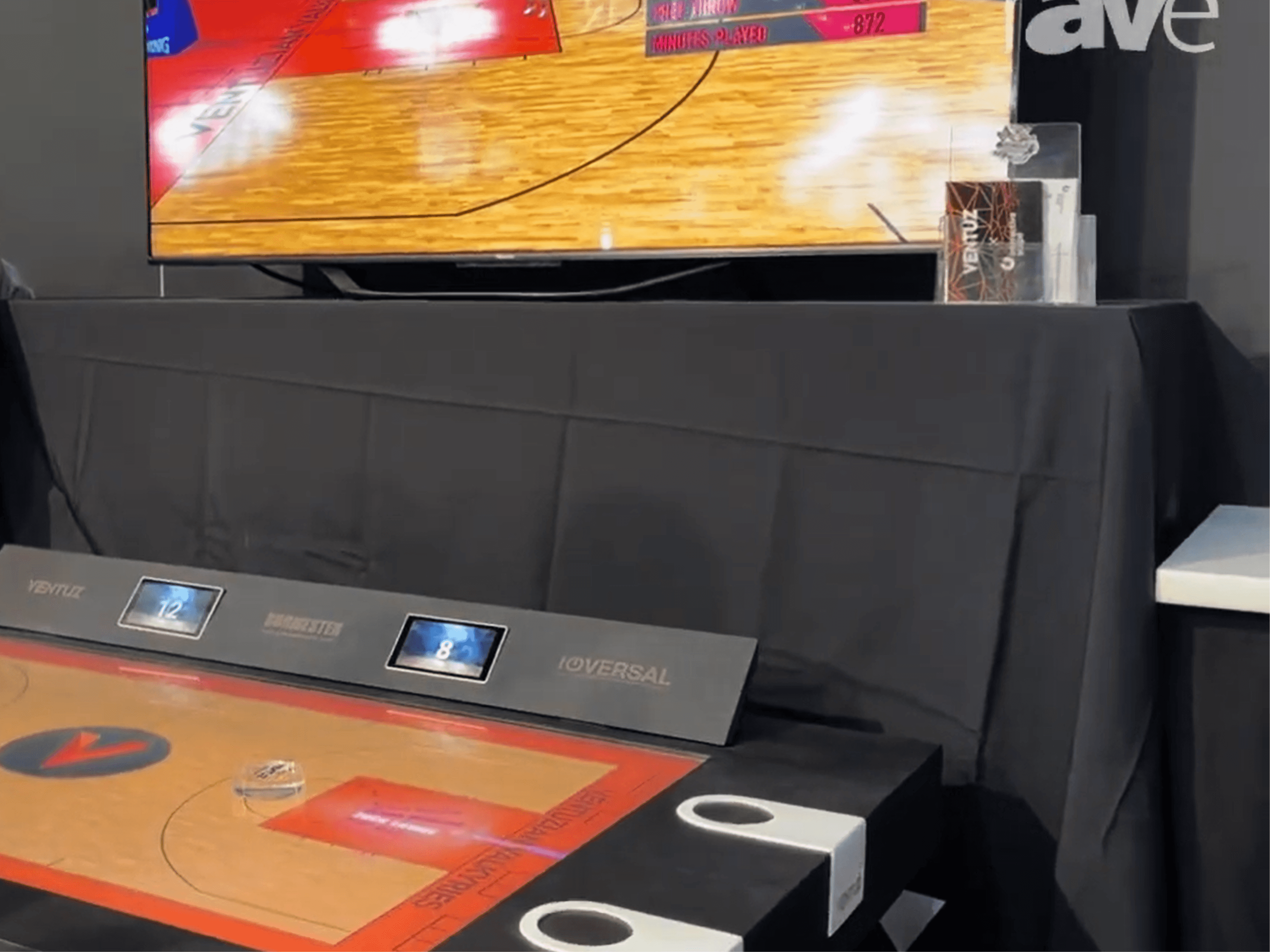 Scape table at the Ventuz booth with a connected screen mirroring the court and live statistics
